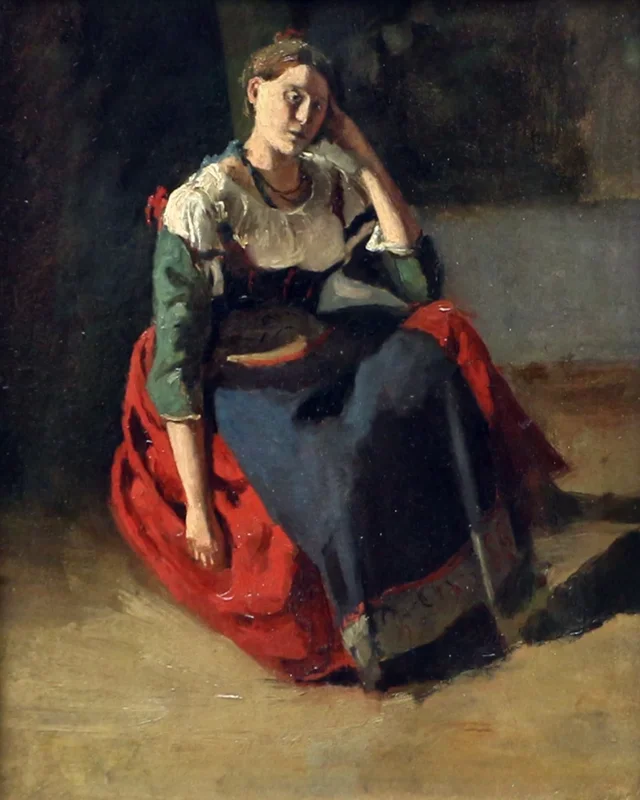 膝に肘をついて座るイタリアの女