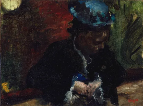 Au théâtre : femme assise au balcon