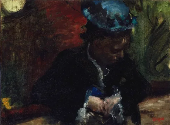Au théâtre : femme assise au balcon