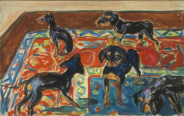 敷物の上の五匹の子犬