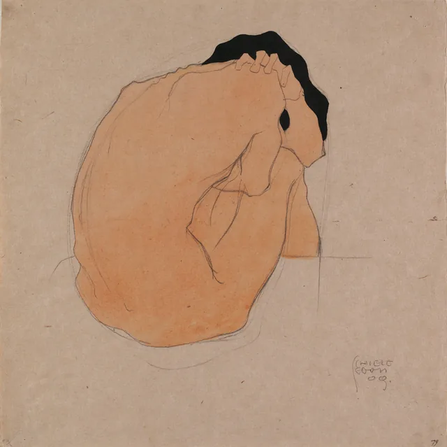 黒髪の座る男