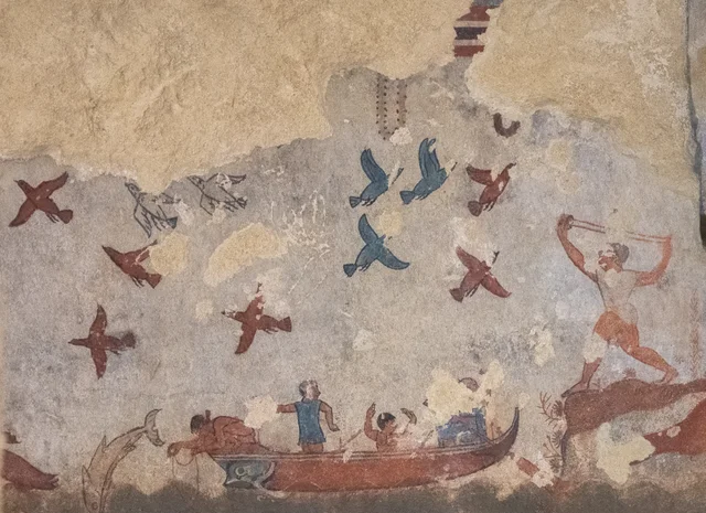 Fishermen in their boat and a flight of birds