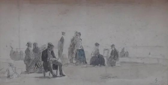 Sur la plage, l'homme assis
