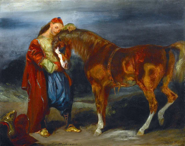 Joven turco acariciando a su caballo