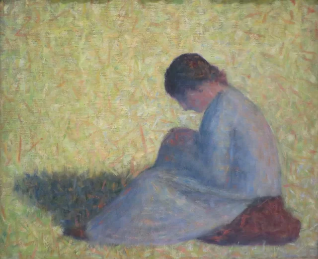 Campesina sentada en la hierba