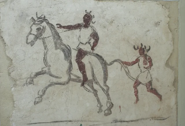 Horseman and groom