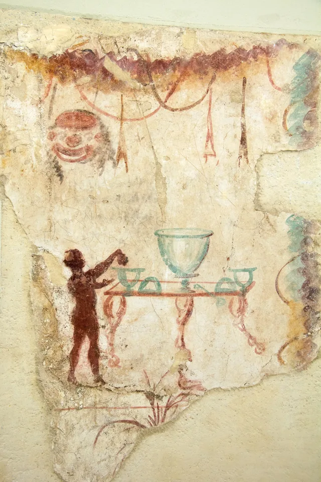 Servant at the krater and garlands (banquet)