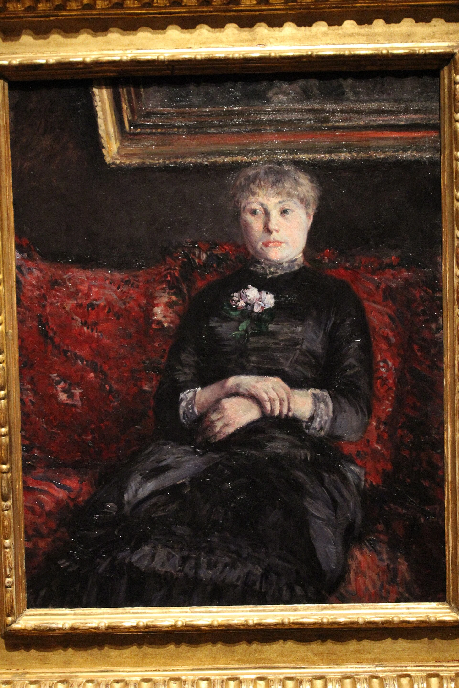 Woman Seated on a Red-Flowered Sofa, Gustave Caillebotte
