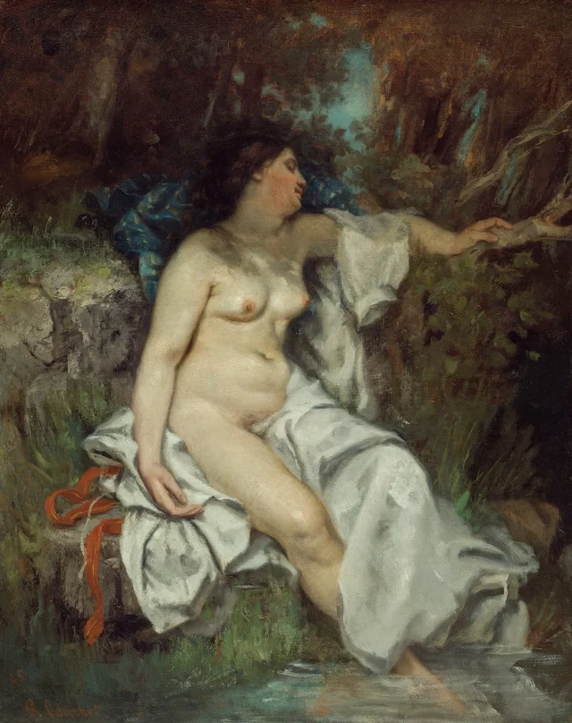 Bañista dormida junto a un arroyo