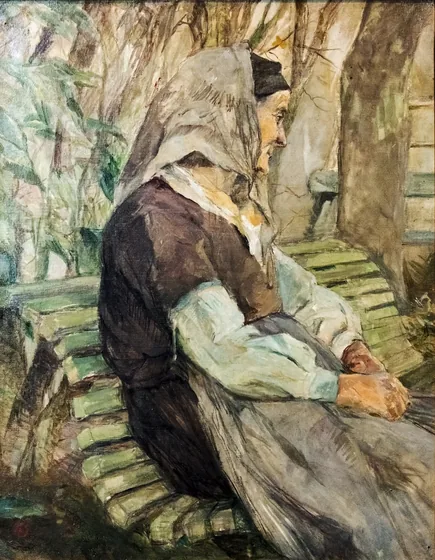 Vieille femme assise sur un banc à Céleyran