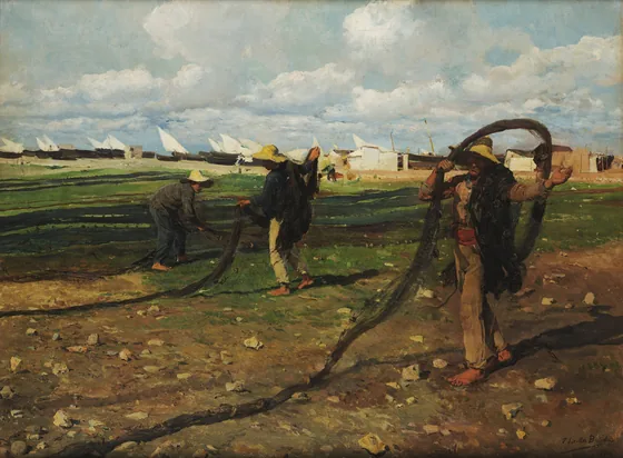 Fishermen taking up nets