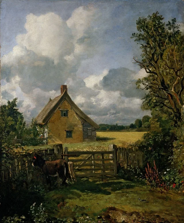 La casa de campo en un campo de trigo