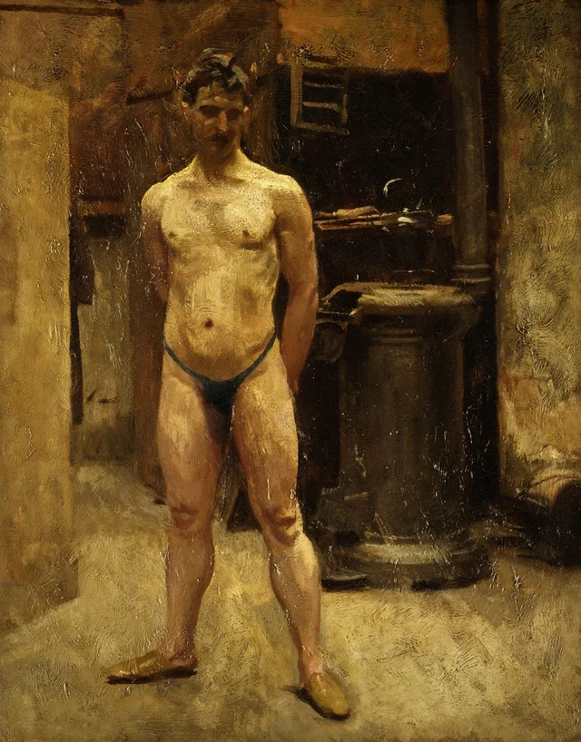 Modelo masculino de pie junto a una estufa