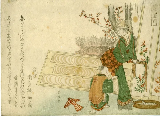 Woman washing cloth, some drying on a board, and boy with a kite