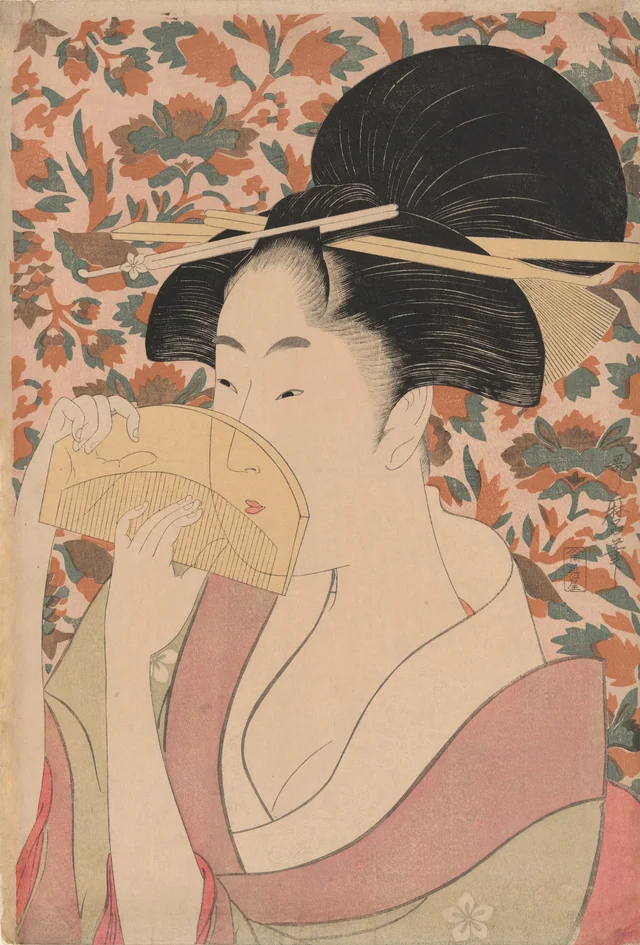 鼈甲の櫛を持つ女