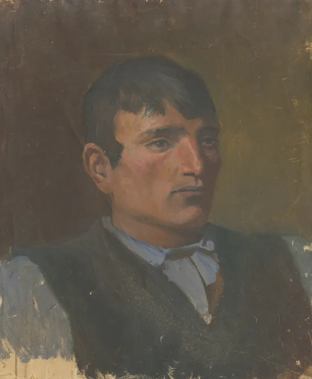 Estudio de joven con chaleco oscuro