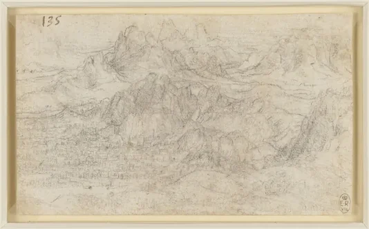 Ville au fond d'une vallée devant des montagnes