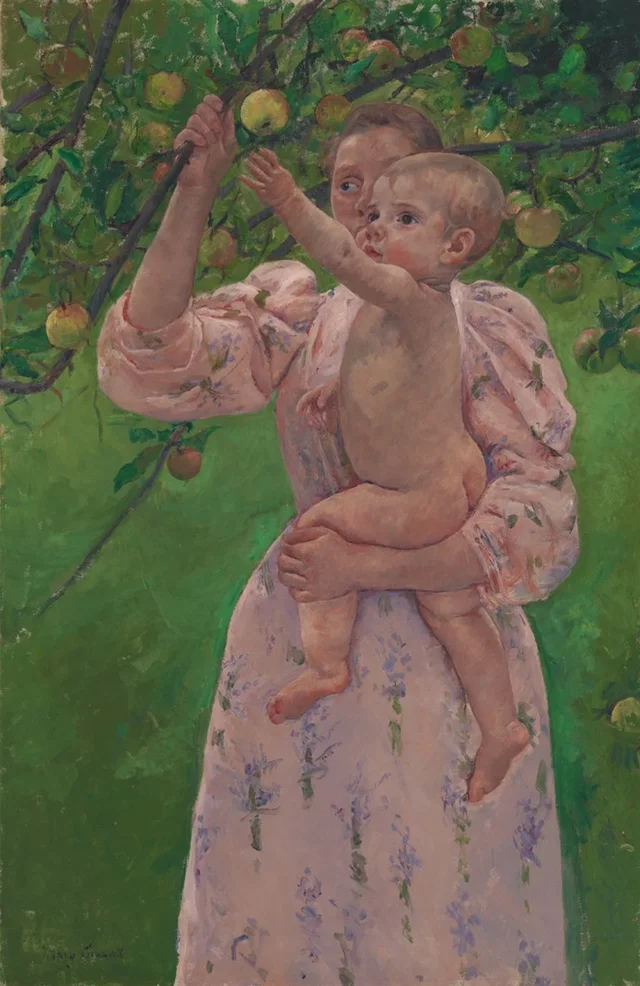 Niño cogiendo una fruta