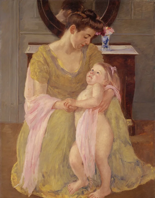 Madre e hijo con una bufanda rosa