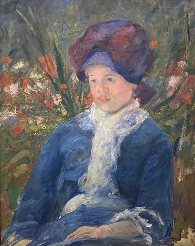 Susan sentada en un jardín