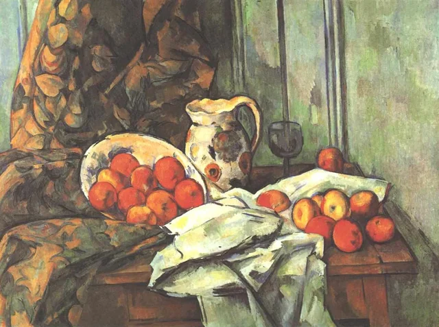 Manzanas y jarro sobre una mesa