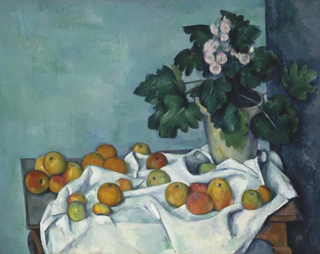 Tiesto de primaveras y frutas sobre una mesa