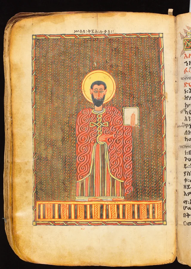 Book of the Gospels: standing evangelist holding a book