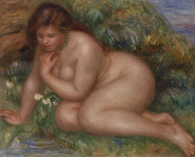 Bañista mirándose en el agua