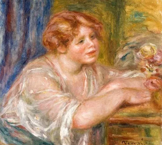 Buste de jeune fille regardant des fleurs