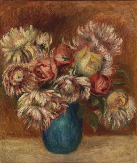 Fleurs dans un vase vert