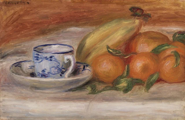 Naranjas, plátanos y taza de té