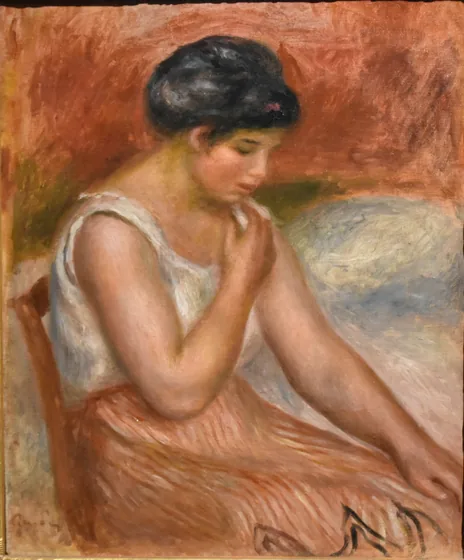 Seated Girl in striped Skirt