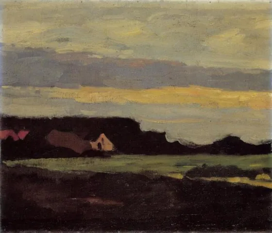 Farm buildings in white and red near a green field