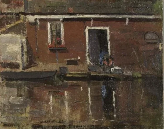 House façade on the water with woman washing