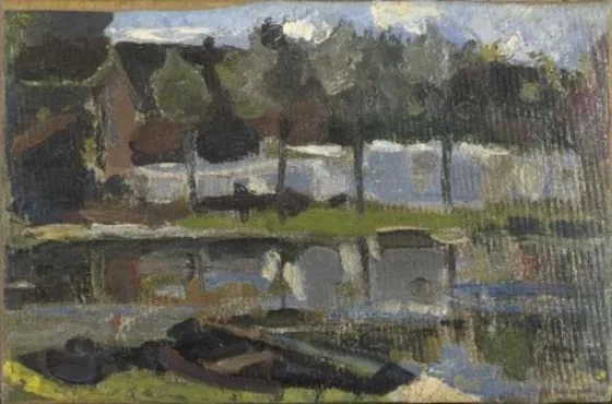 Narrow farm building and trees along the water