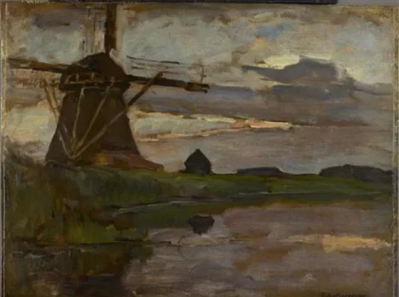 Oostzijdse mill viewed from downstream with streaked blue and yellow sky