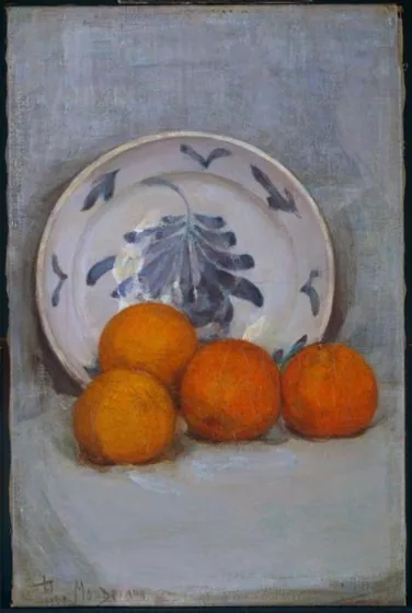 Oranges and decorated plate