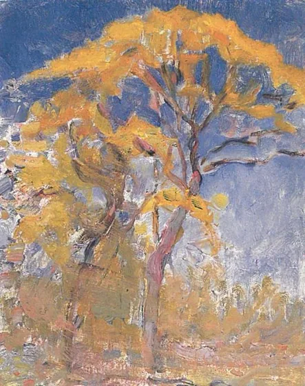 Two trees with orange foliage against blue sky