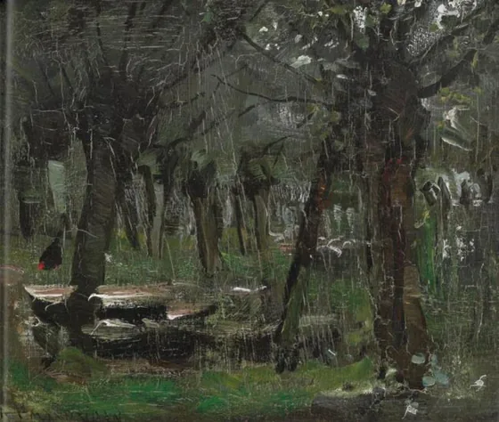 Willow grove with boats near the river Gein