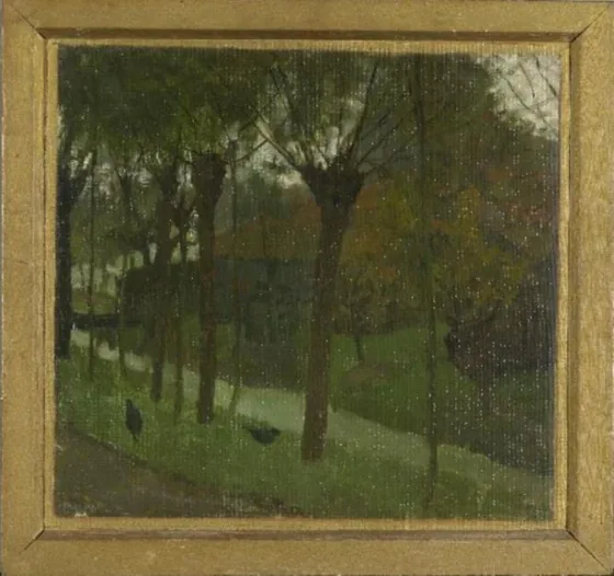 Willows bordering an irrigation ditch near a farm building