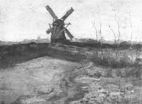 Windmill with church towers in the distance