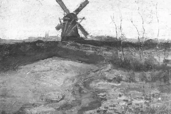 Windmill with church towers in the distance