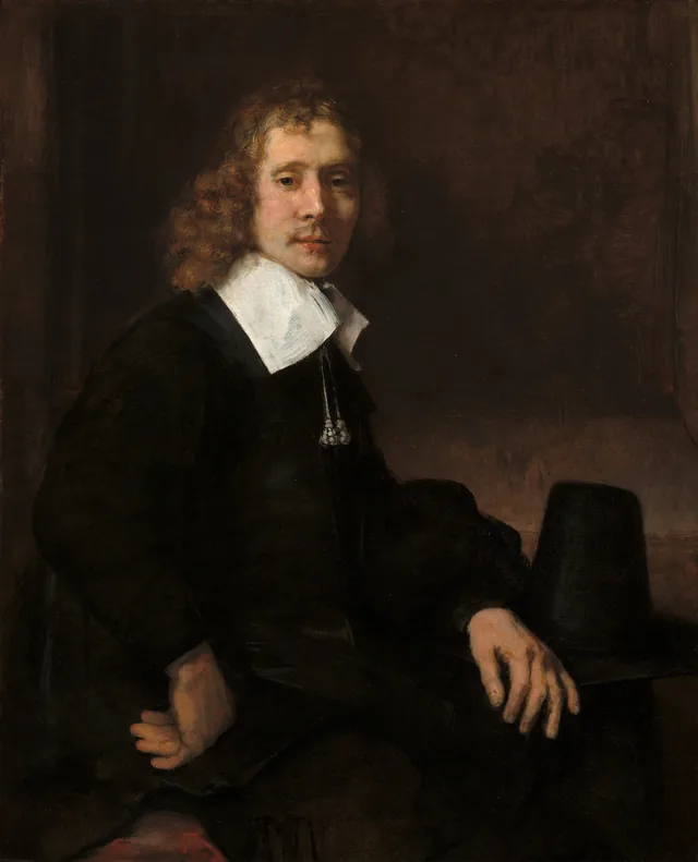 A Young Man Seated at a Table (possibly Govaert Flinck), Rembrandt van Rijn