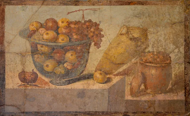 Still life with a bowl of fruit and wine
